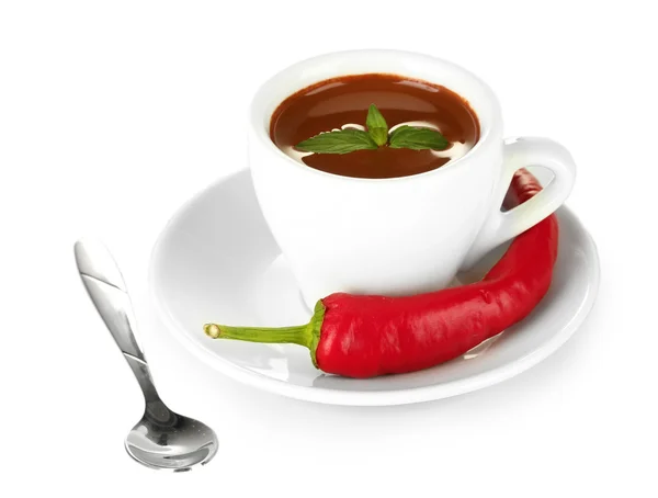 White cup with hot chocolate and chili pepper isolated on white Stock Photo