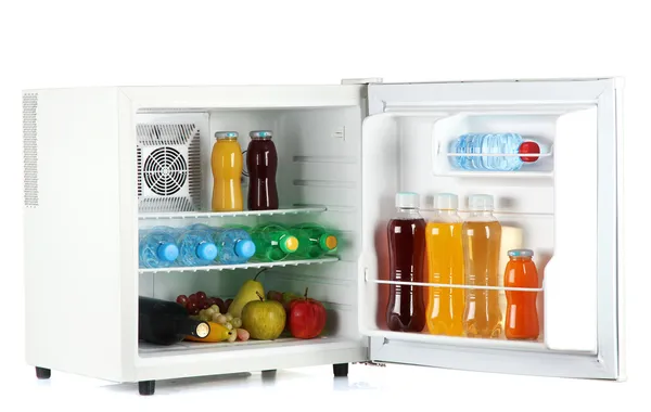 Mini fridge full of bottles of juice, soda and fruit isolated on white — Stock Photo, Image