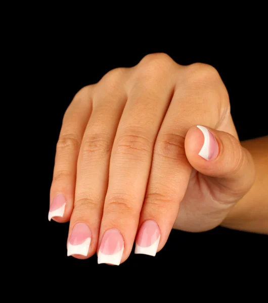 Beautiful woman's hand with french manicure on black background — Stock Photo, Image