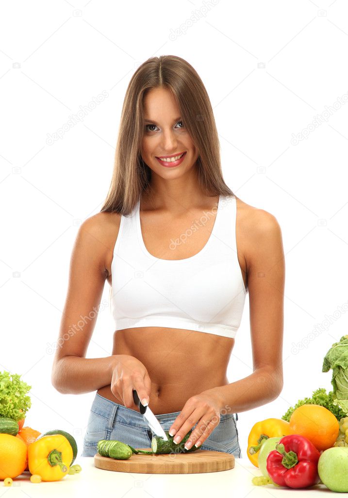 beautiful young woman cutting vegetables, isolated on white