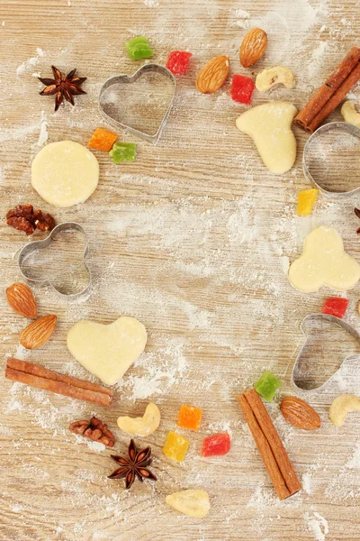 Frame made of candied fruit, nuts, unbaked biscuits and molds for cookies o — Stock Photo, Image