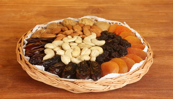 Different dried fruits on wooden background — Stock Photo, Image
