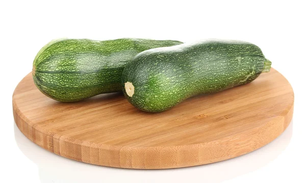 Färsk zucchini på skärbräda isolerad på vit — Stockfoto