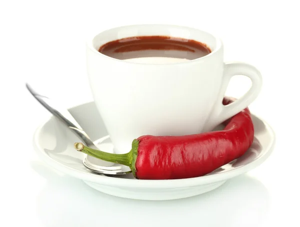 White cup with hot chocolate and chili pepper isolated on white Royalty Free Stock Images