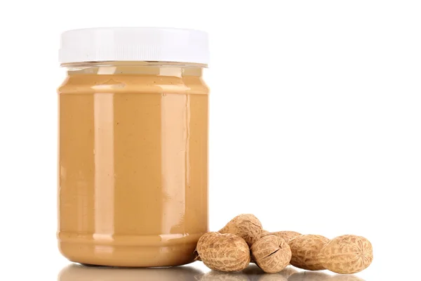 Delicious peanut butter in jar of peanut near isolated on white — Stock Photo, Image