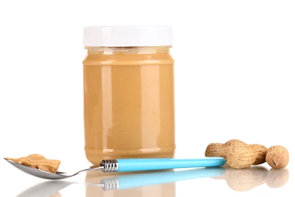 Delicious peanut butter in jar isolated on white — Stock Photo, Image