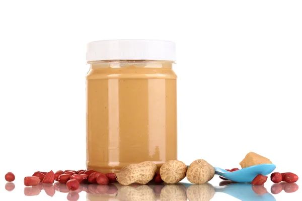 Delicious peanut butter in jar isolated on white — Stock Photo, Image