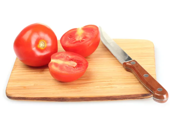 Ripe red tomatoes and knife on cutting board isolated on white — Stock Photo, Image