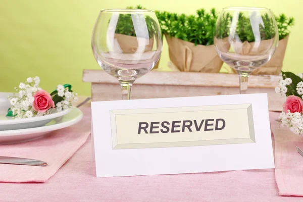 Table setting with reserved card in restaurant — Stock Photo, Image