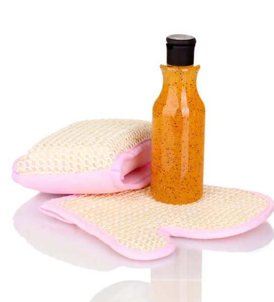 Bottle with scrub and sponges isolated on white — Stock Photo, Image