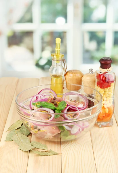 A large piece of pork marinated in bowl with herbs, spices and cooking oil — Stock Photo, Image