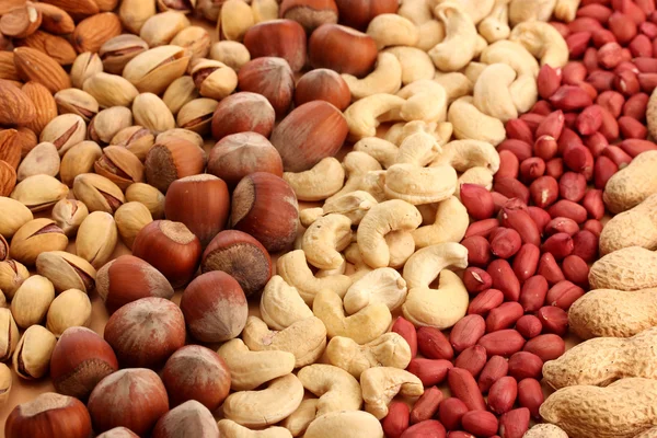 Assortiment van smakelijke noten, close-up — Stockfoto