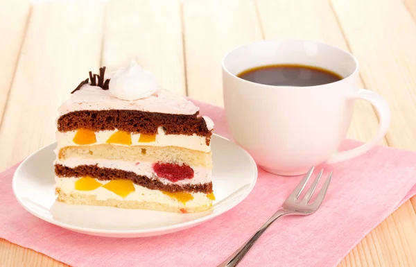 Layered fruit cake on wooden table — Stock Photo, Image