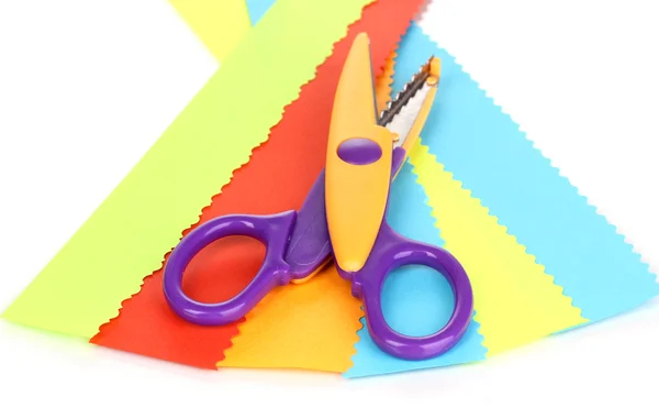 Colorful zigzag scissors with color paper isolated on white — Stock Photo, Image