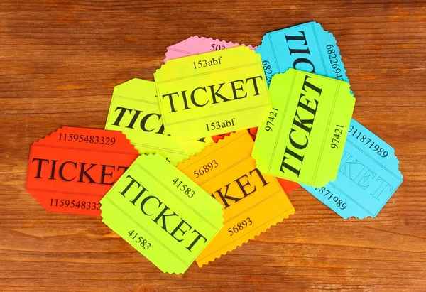 Colorful tickets on wooden background close-up — Stock Photo, Image