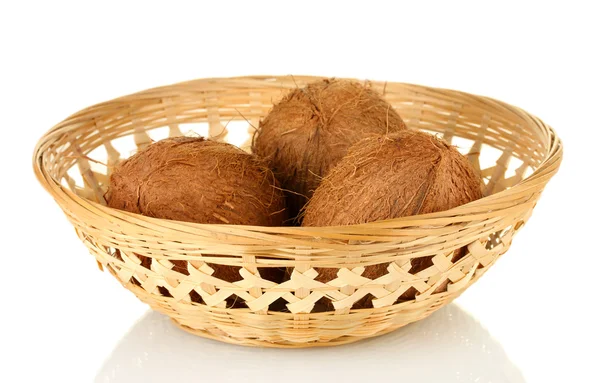 Coconuts in wicker basket isolated on white — Stock Photo, Image