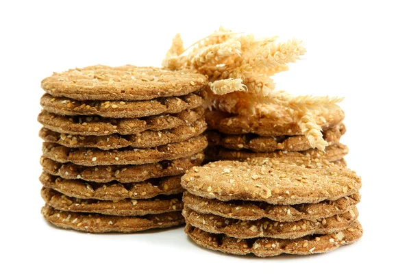 Saporito pane croccante e spighe, isolato su bianco — Foto Stock