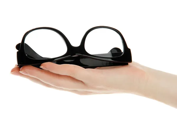 Black glasses on woman hand, isolated on white — Stock Photo, Image