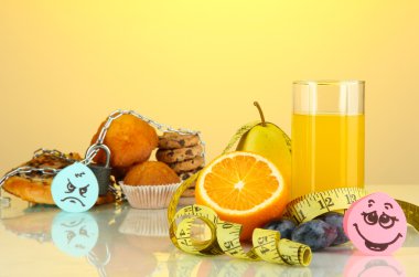 Useful and harmful food on yellow background clipart