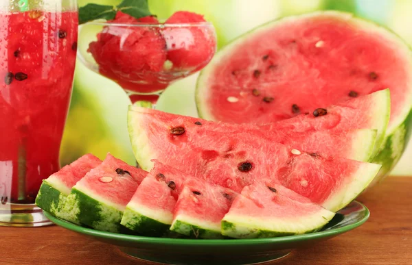 Refreshing desserts of watermelon on green background close-up — Stock Photo, Image