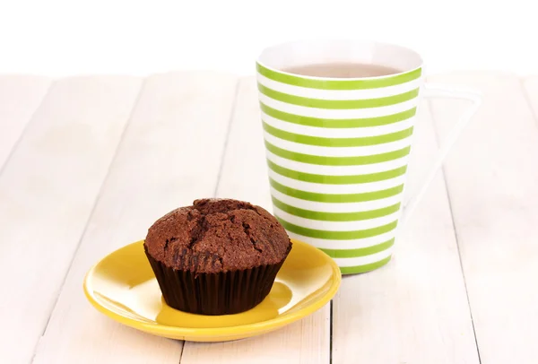 Fresh muffin with tea on wooden background — Stock Photo, Image