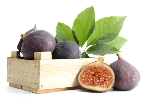 Ripe sweet figs with leaves in wooden crate isolated on white — Stock Photo, Image