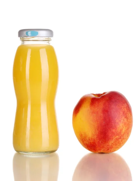 Delicious peach juice in glass bottle and peach next to it isolated on whit — Stock Photo, Image