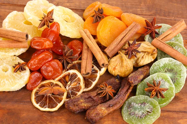 Dried fruits with cinnamon and anise stars close-up — Stock Photo, Image