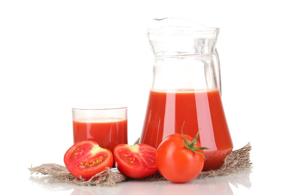 Tomato juice in pitcher and glass on sackcloth isolated on white — Stock Photo, Image