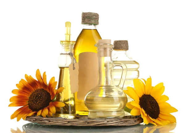 Oil in jars and sunflowers, isolated on white — Stock Photo, Image