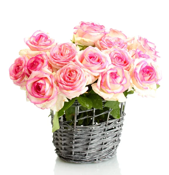 Beautiful bouquet of pink roses in wicker vase, isolated on white — Stock Photo, Image