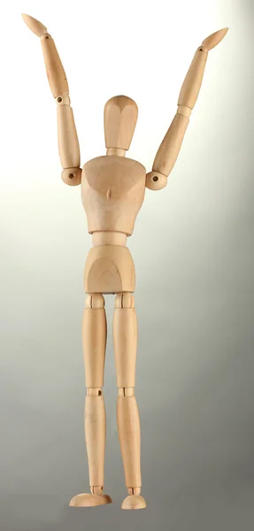 Wooden mannequin, on grey background — Stock Photo, Image