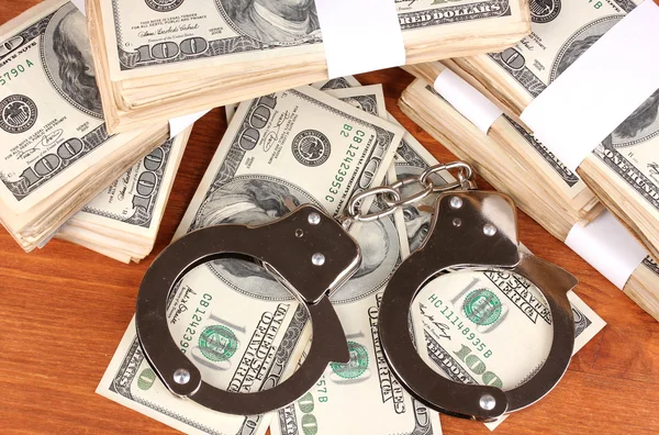 Idea of punishment for financial fraud, on wooden background — Stock Photo, Image