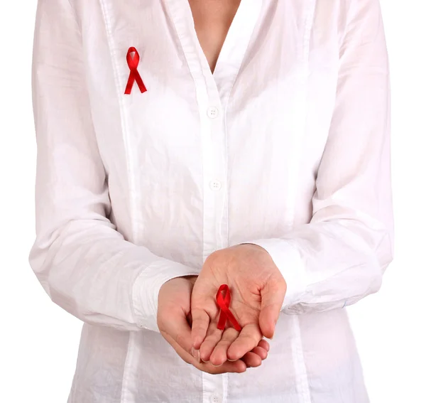 Woman with red ribbon in hands on isolated on white — Stock Photo, Image