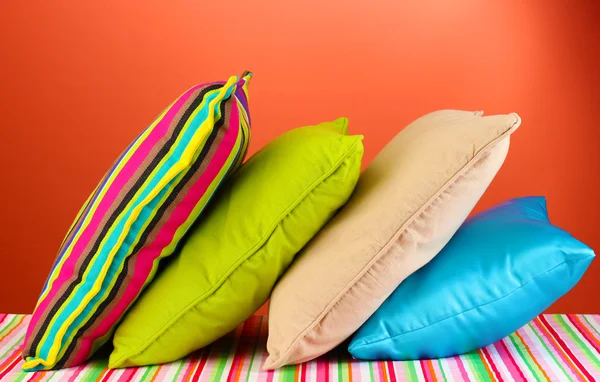 Pillows on red background — Stock Photo, Image