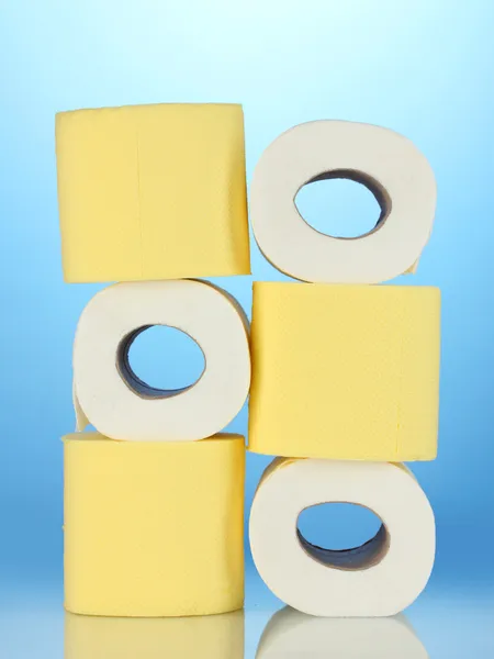 Rolls of toilet paper on blue background — Stock Photo, Image