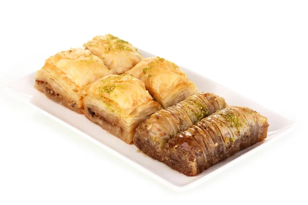 Baklava dulce en placa aislada en blanco —  Fotos de Stock