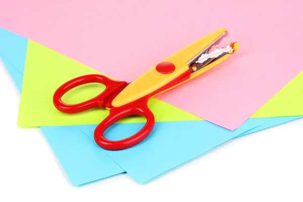 Colorful zigzag scissors with color paper isolated on white — Stock Photo, Image