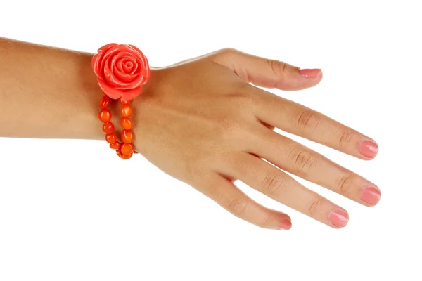 Beautiful peach-colored bracelet with rose on hand isolated on white — Stock Photo, Image