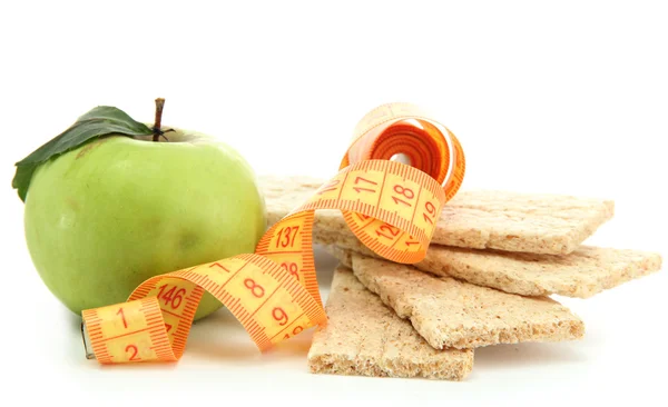 Tasty crispbread, apple and measuring tape, isolated on white — Stock Photo, Image