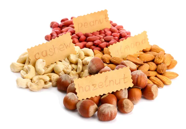 Assortiment van smakelijke noten, geïsoleerd op wit — Stockfoto