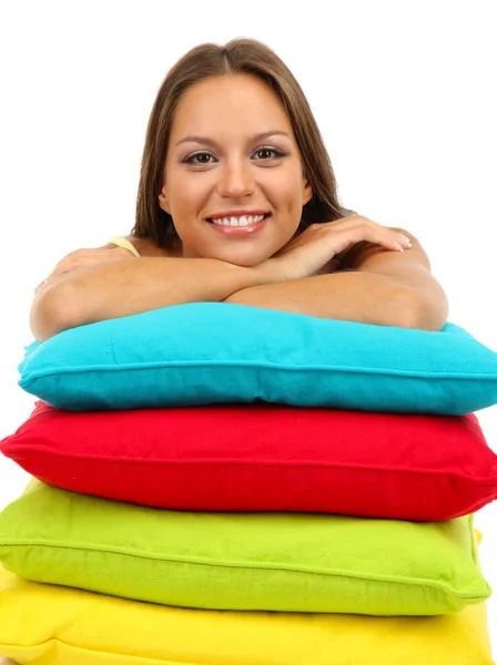 Hermosa joven con almohadas aisladas en blanco — Foto de Stock