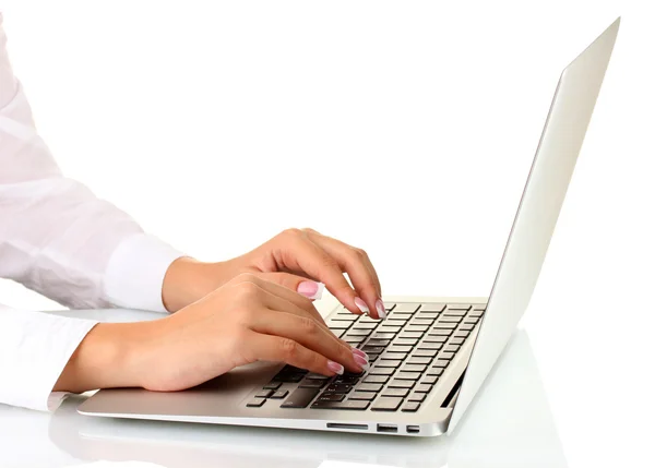 Business woman's hands typing on laptop computer, on white background close Stock Photo