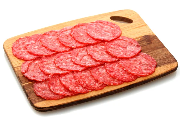 Tasty sausage on wooden cutting board, isolated on white — Stock Photo, Image