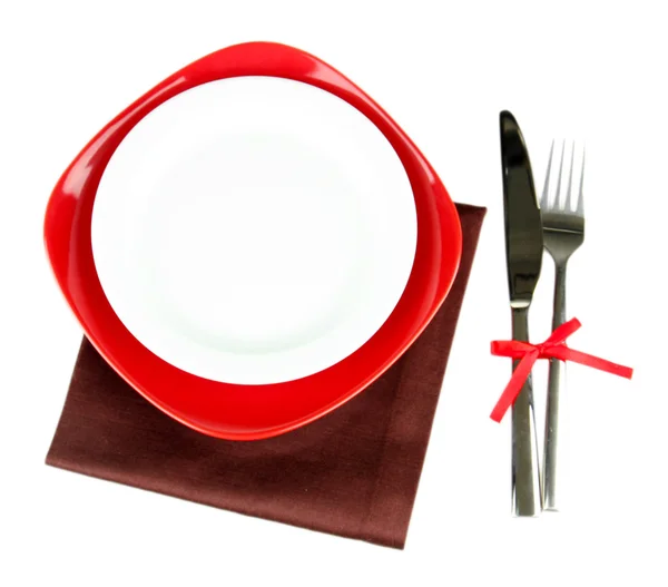 Empty red and white plates with fork and knife isolated on white — Stock Photo, Image