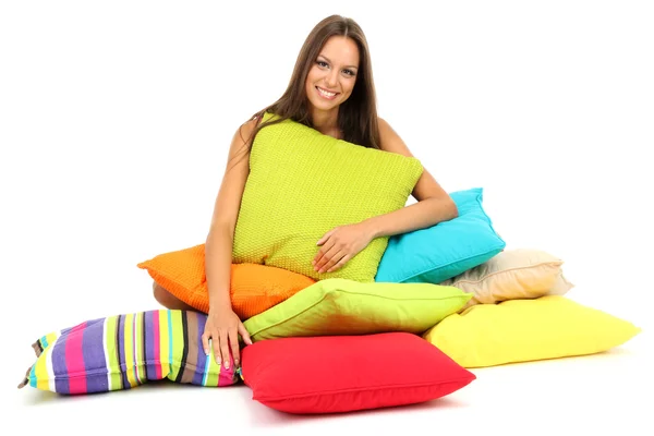 Beautiful young girl with pillows isolated on white — Stock Photo, Image