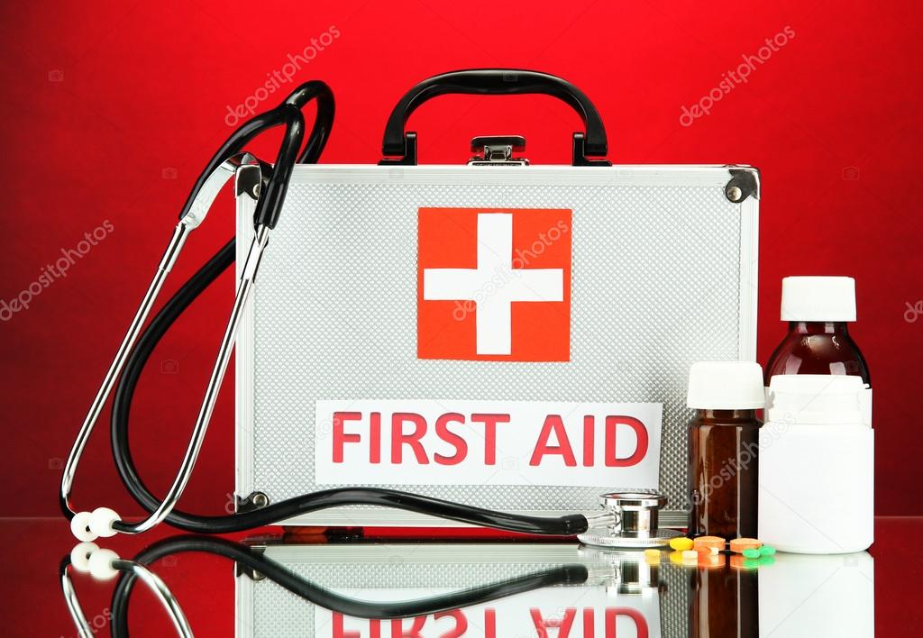 First aid box, on red background