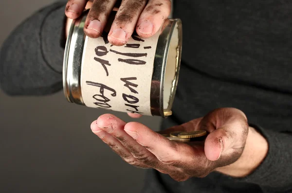 Homeless pours money from bank, close-up — Stock Photo, Image