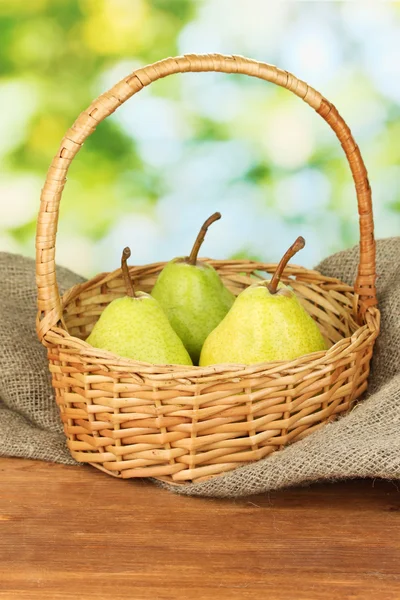 Ripe pears on colorful green background — Stock Photo, Image