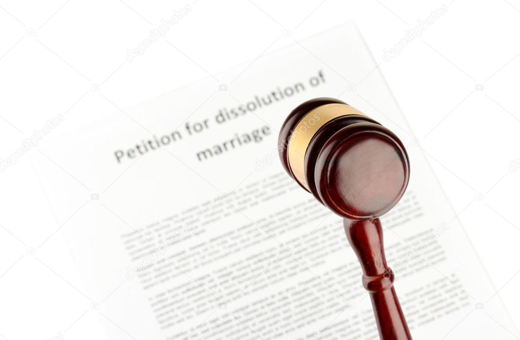 Divorce decree and wooden gavel on white background